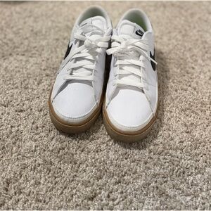 Nike White Sneakers with Black Swoosh and Gum Sole